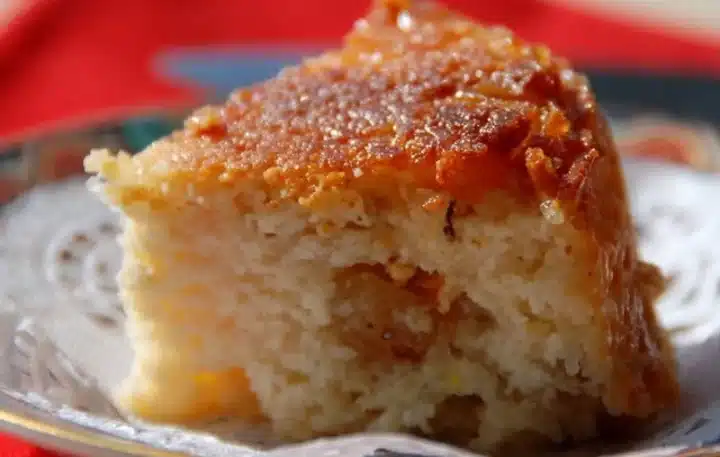 A close-up shot of a traditional Rath Yatra Food Poda Pitha