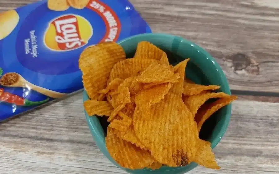 Packet of Lays and a bowl full of chips