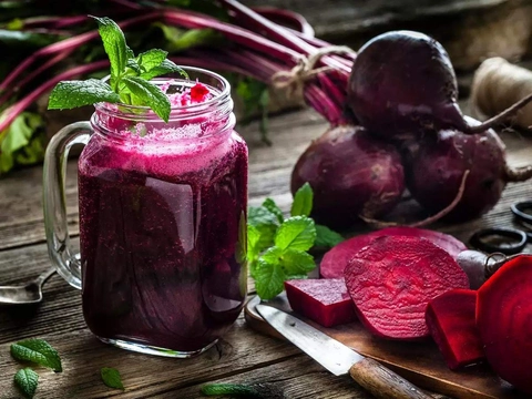 An image of Beetroot Juice. It is covered by beetroot and beet slices | Drinks to lower cholesterol