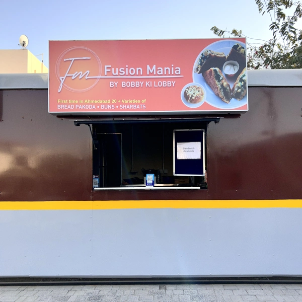 An image of Fusion Mania stall at Bogie Chefs. You can see the red board with food images and its counter.