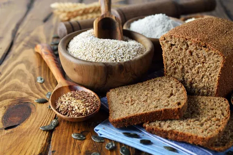Image of Whole Grains like whole wheat bread, brown rice, and quinoa.