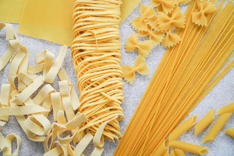 An image of raw spaghetti and noodles.