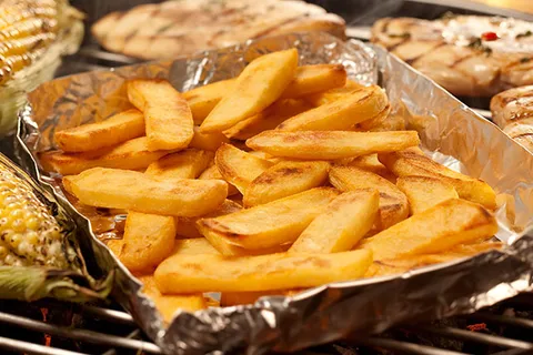 Image of steak fries served in foil paper | Types of French Fries